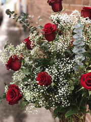 A Dozen Classic Roses Arranged in a Vase