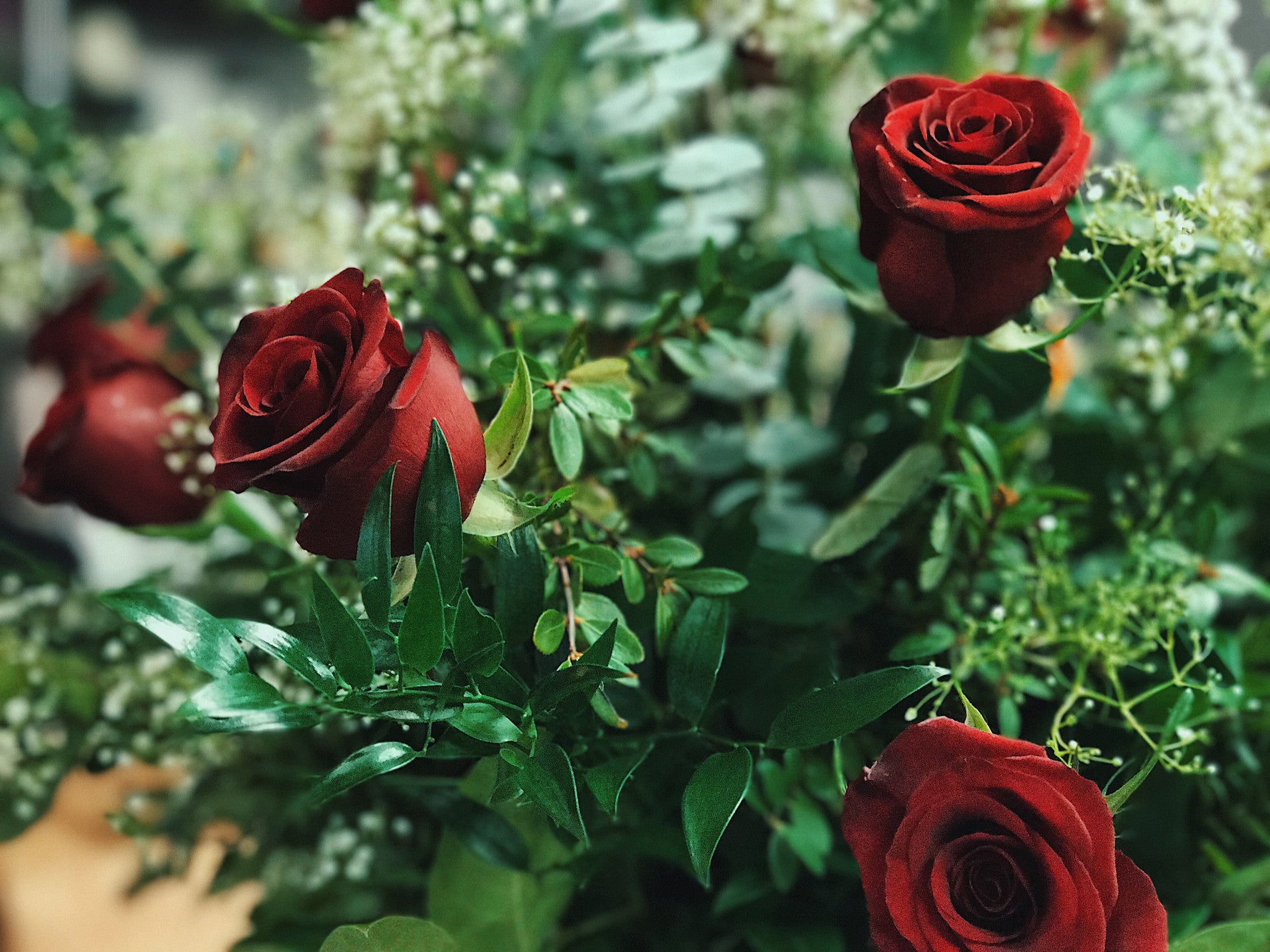 A Dozen Classic Roses Arranged in a Vase